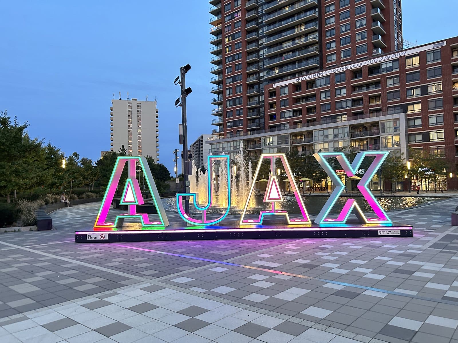 The illuminated AJAX sign at Pat Bayly Square