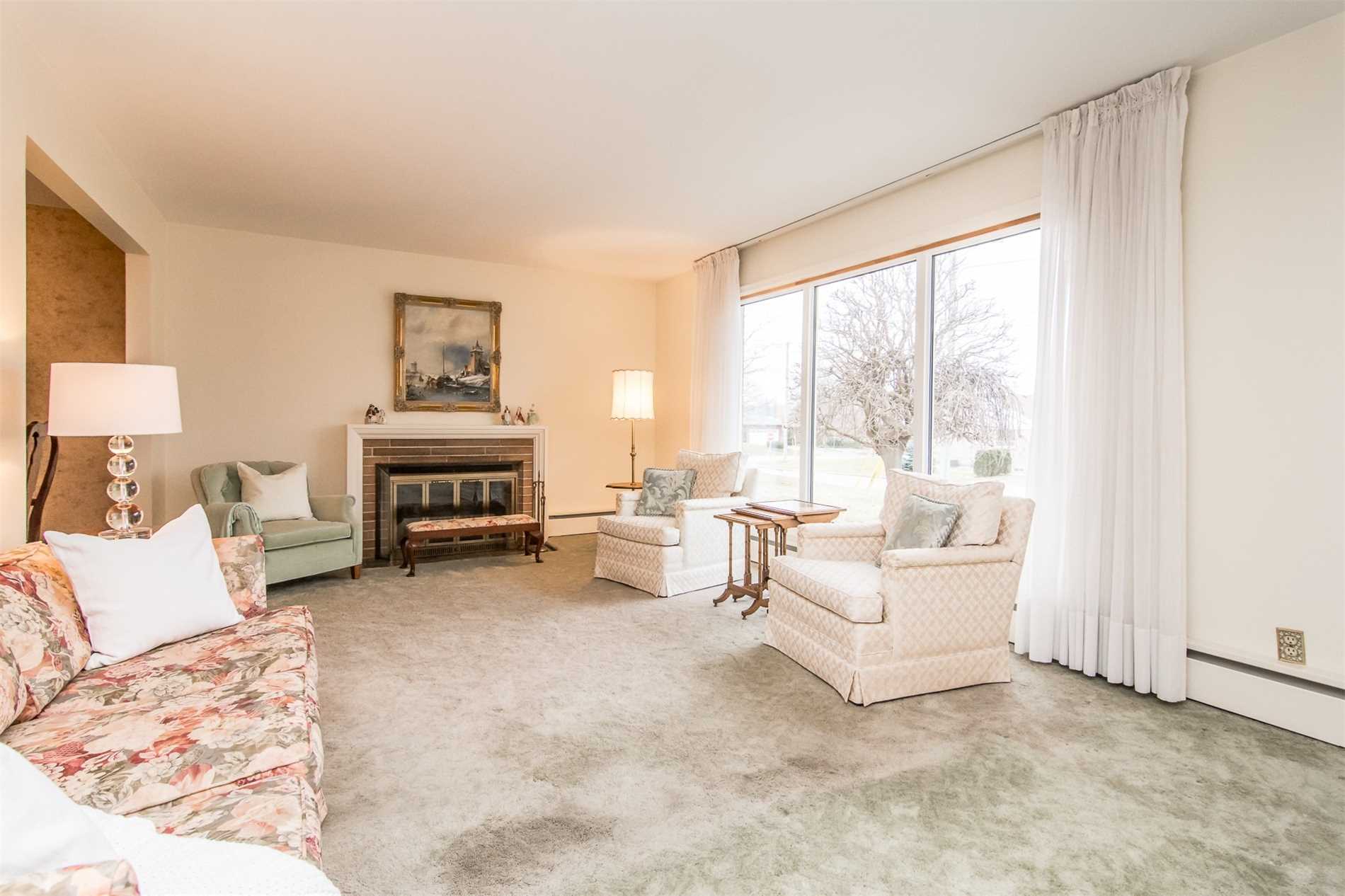 Living room with fireplace, 132 Winona Ave, Oshawa, before renovation
