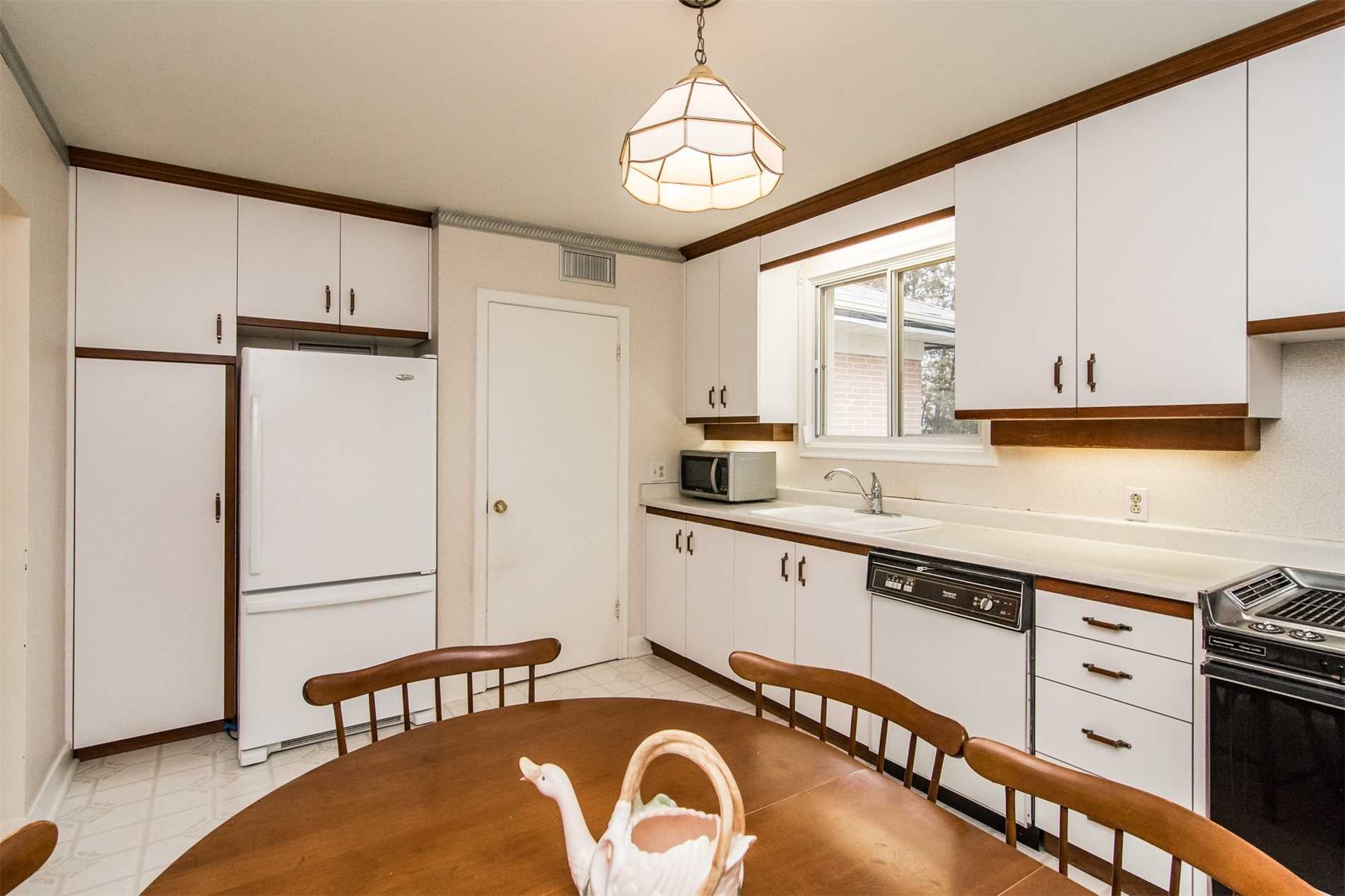 Kitchen and open concept, 132 Winona Ave, Oshawa, before renovation